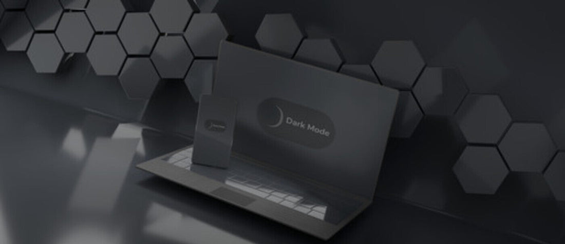 A laptop and phone displaying Dark Mode on a dark-themed background with hexagonal patterns.