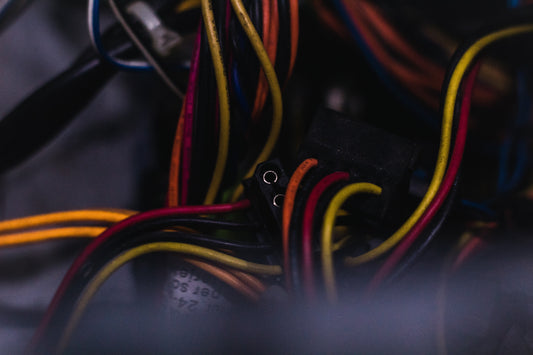 A close-up view of colorful electrical wiring in a computer or technical setup.