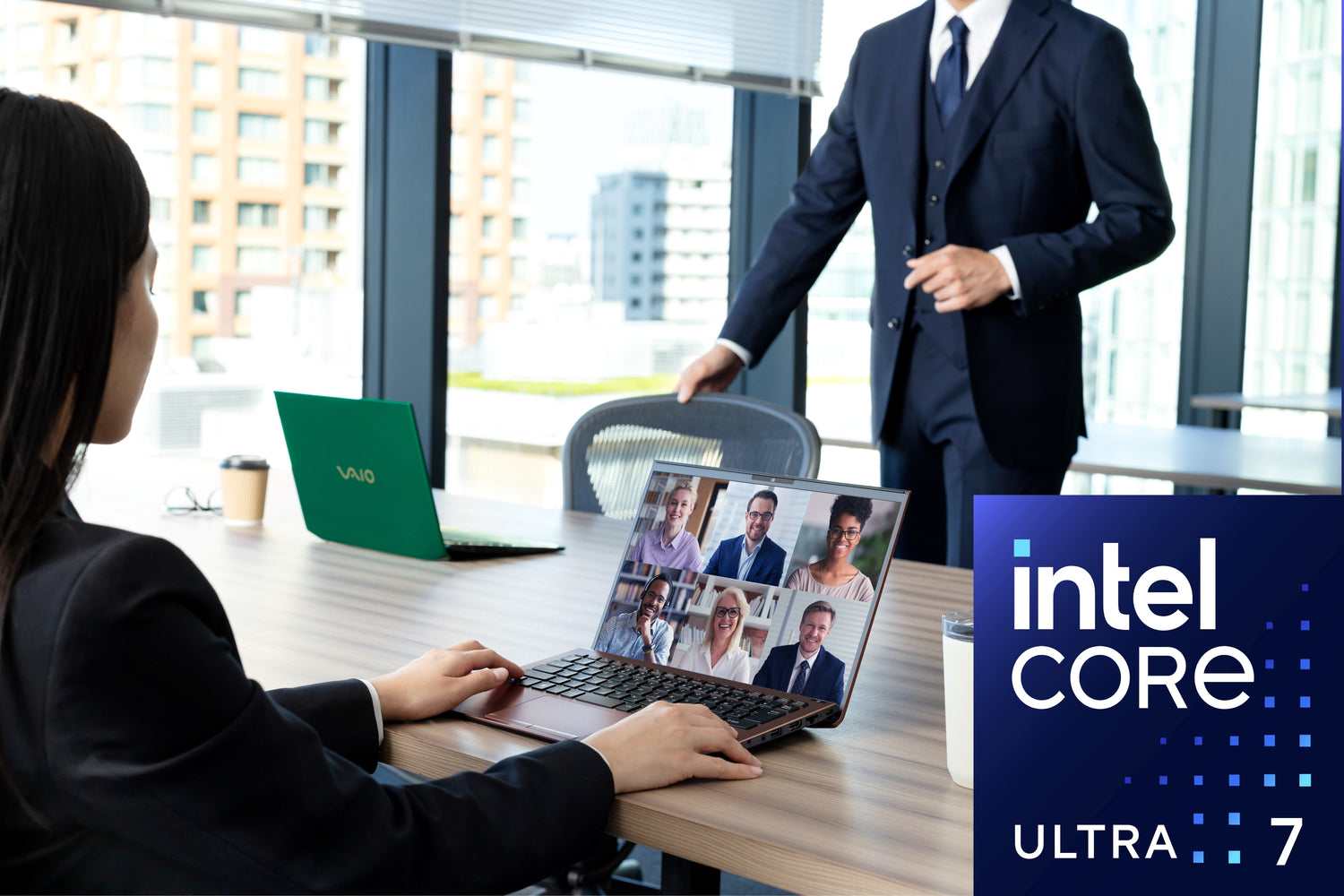 A business meeting in a modern office with Intel Core Ultra 7 laptops, ideal for video conferences.