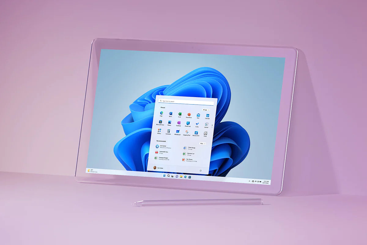 A tablet with a stylus, displaying the Windows 11 desktop interface, set against a purple background.