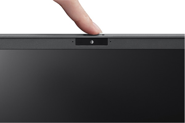 A finger sliding the privacy shutter over the VAIO laptop's webcam for enhanced security and privacy protection.