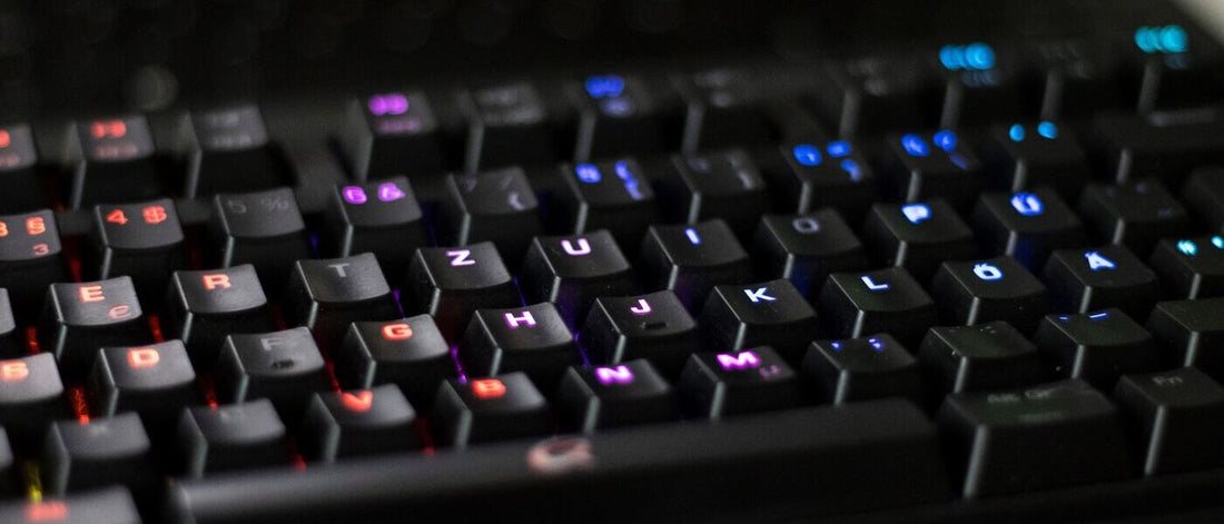 This is a close-up shot of a keyboard with colorful backlighting on the keys.