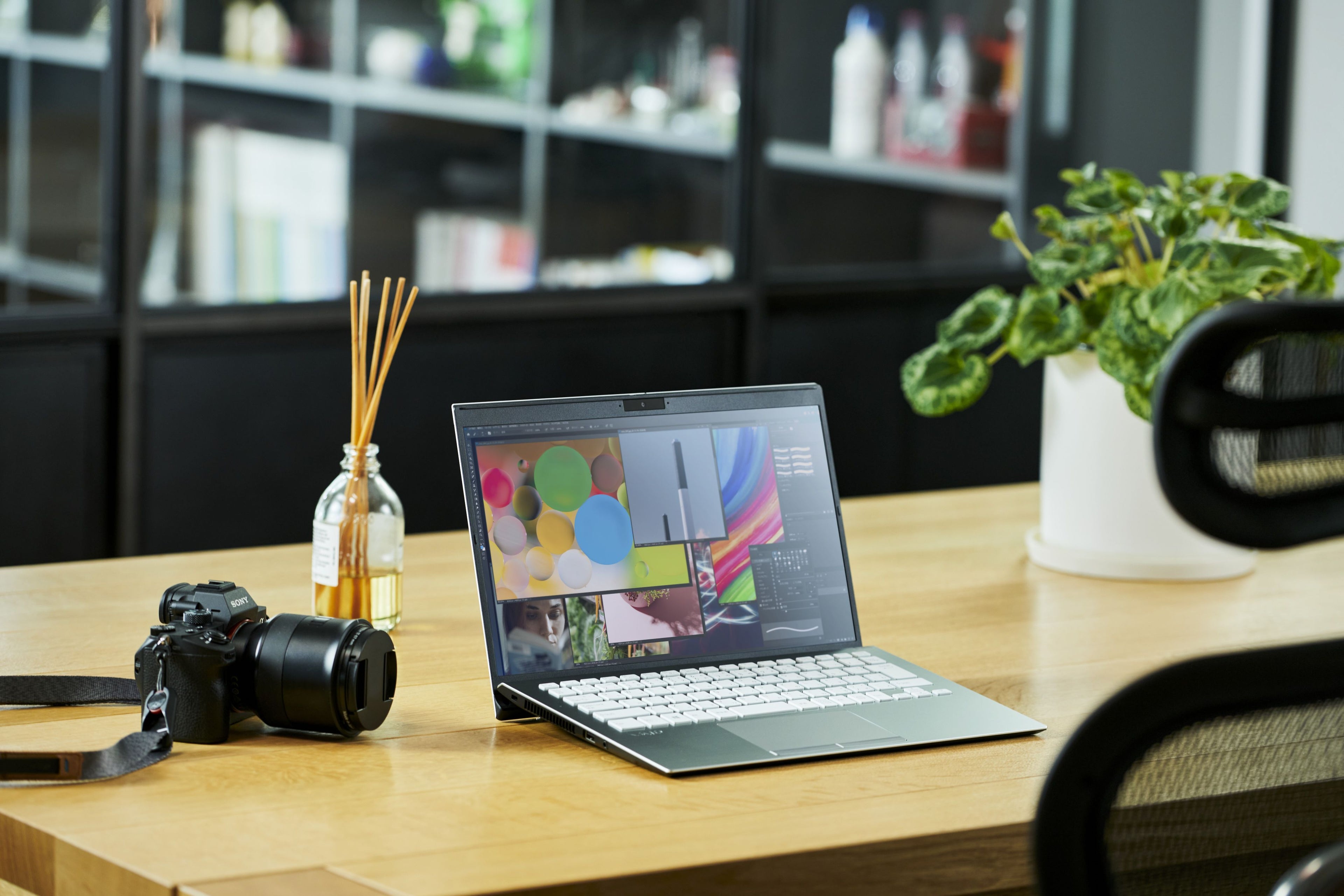 A VAiO laptop sitting on a table in an indoor office setting.